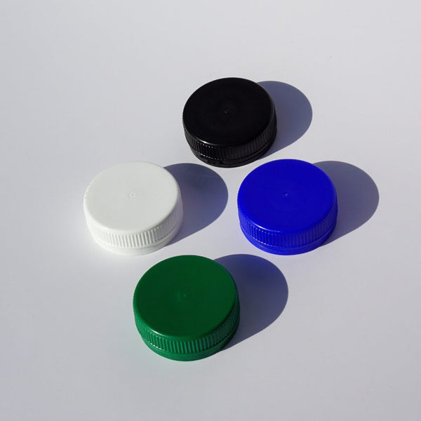 tjurade kapsyler 38 mm vit, svart, blå oh grön